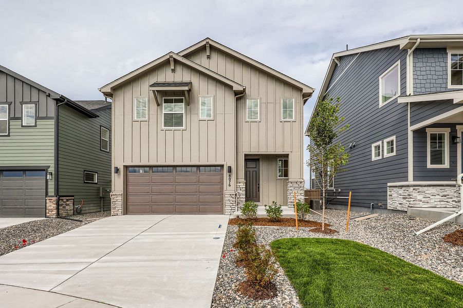 Front exterior of a new home in Sterling Ranch 40s, Colorado Springs, CO, highlighting curb appeal (Image 1).
