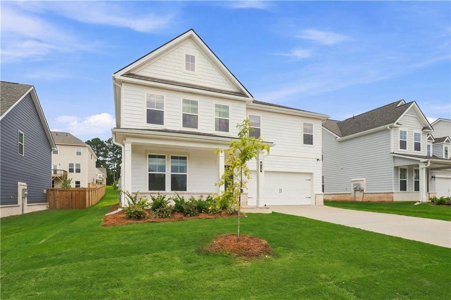 Front exterior of a new home in Cooper Park, McDonough, GA, highlighting curb appeal (Image 2). Front exterior of a new home in Cooper Park, McDonough, GA, highlighting curb appeal (Image 2).