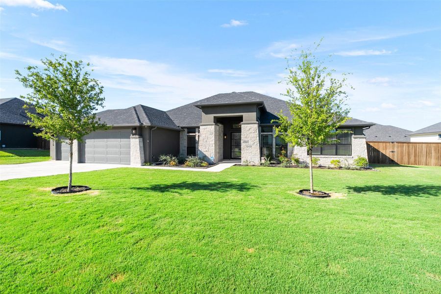 Front exterior of a new home in , Nolanville, TX, highlighting curb appeal (Image 1).