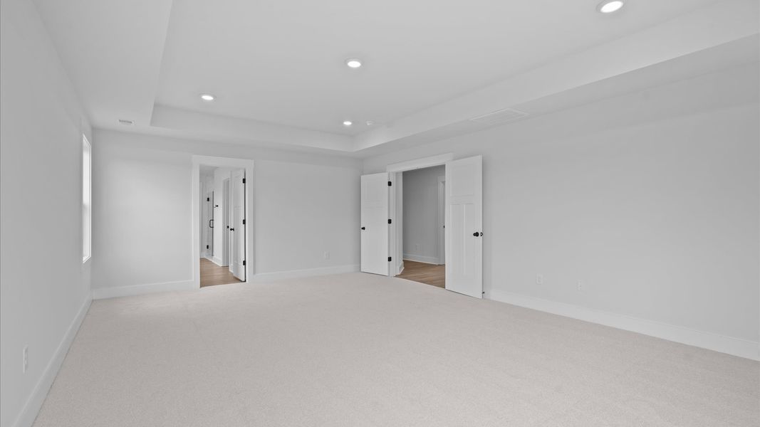 Primary suite that offers first-rate relaxation with established style and elevated finishes