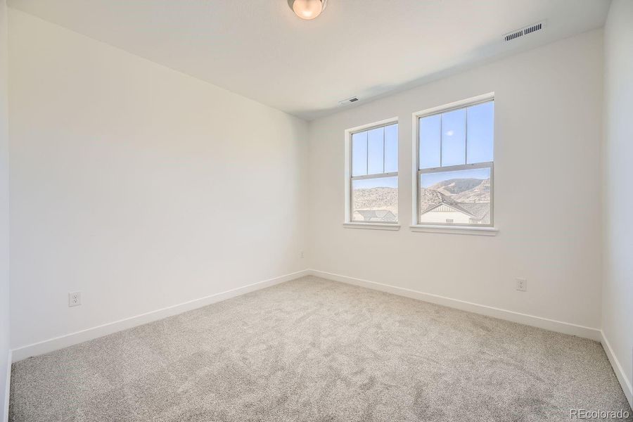 Spacious, unfurnished interior of a new home in Red Rocks Ranch: The Grand Collection, Morrison (Image 9).