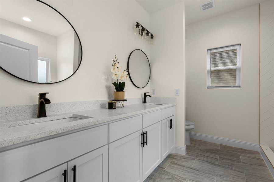 Bathroom with vanity and toilet