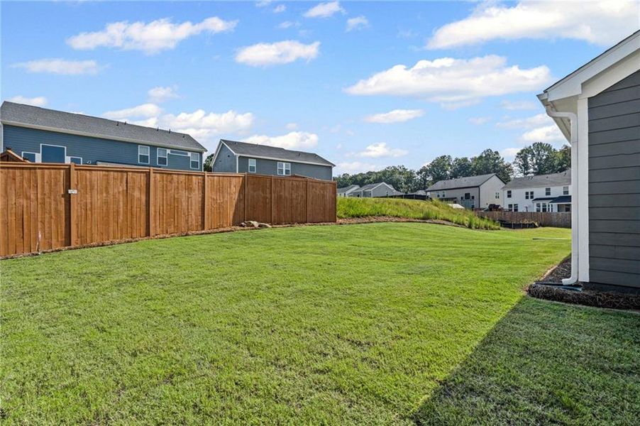Front exterior of a new home in The Reserve At Liberty Park, Braselton, GA, highlighting curb appeal (Image 1). Front exterior of a new home in The Reserve At Liberty Park, Braselton, GA, highlighting curb appeal (Image 1).
