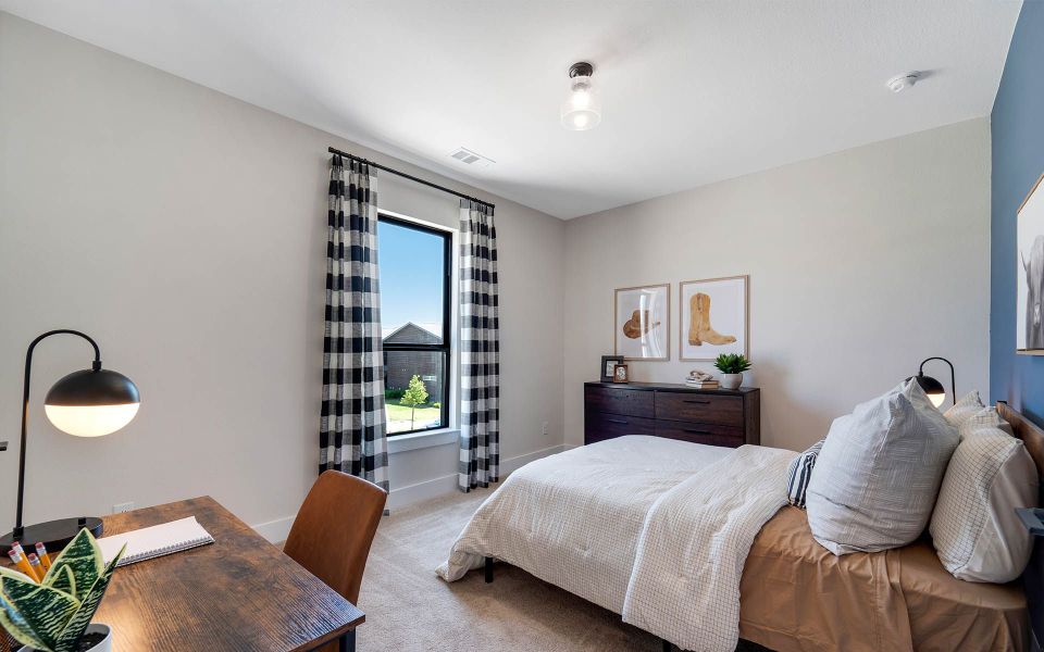 Representative furnished interior of a home built from the Rainier by CastleRock Communities in The Summit at Center Stage, Keller (Image 25).
