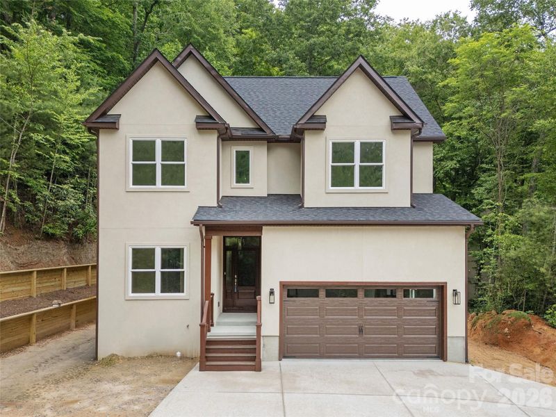 Front exterior of a new home in , Hendersonville, NC, highlighting curb appeal (Image 18). Front exterior of a new home in , Hendersonville, NC, highlighting curb appeal (Image 18).
