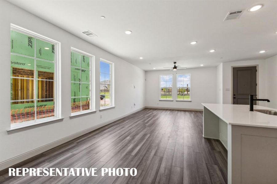 A wall of windows in your new dining area floods the home with natural light.  REPRESENTATIVE PHOTO