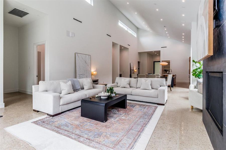 Living room featuring a high ceiling