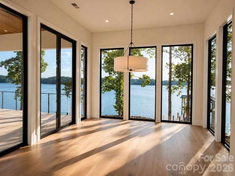Showstopping dining room framed by large bronze Anderson windows Showstopping dining room framed by large bronze Anderson windows