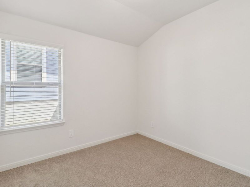 Guest bedroom in the Callaghan floorplan at a Meritage Homes community. Guest bedroom in the Callaghan floorplan at a Meritage Homes community.