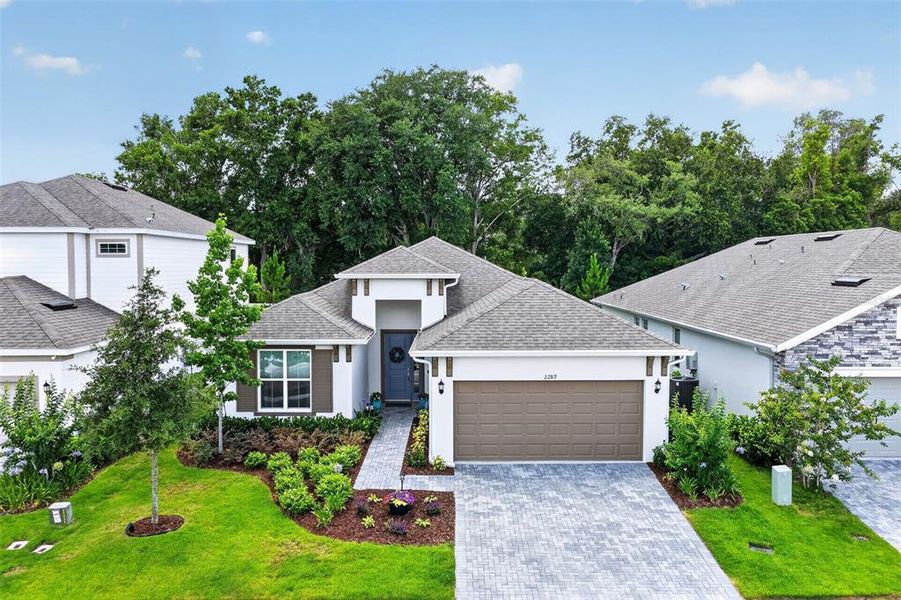 Front exterior of a new home in , Mount Dora, FL, highlighting curb appeal (Image 23).