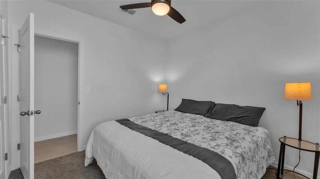 Furnished interior view inside a new home in The Grove at Stuart Crossing - Premier Series, Bartow (Image 26).