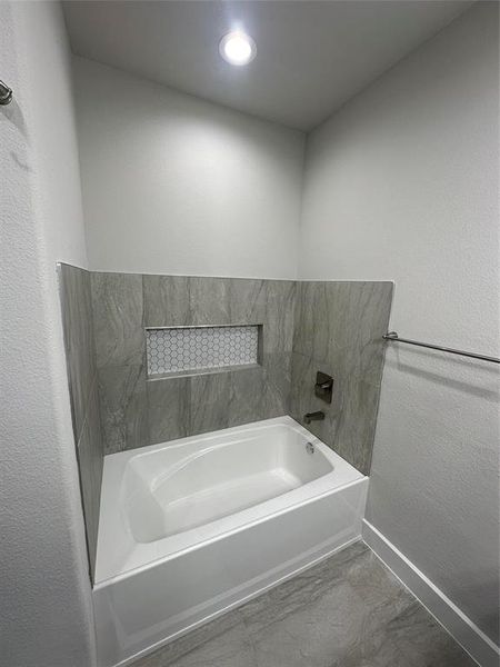 Bathroom featuring tile flooring