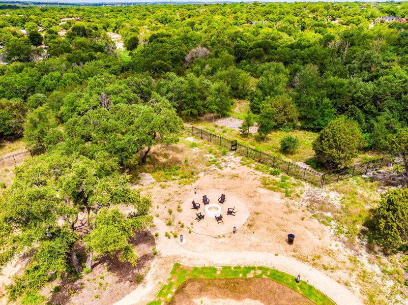 Aerial view of the fire pit with greenbelt behind. Aerial view of the fire pit with greenbelt behind.