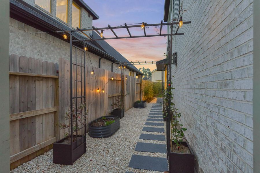 Exterior details and patio area of a home in Audubon 60', Magnolia (Image 26).