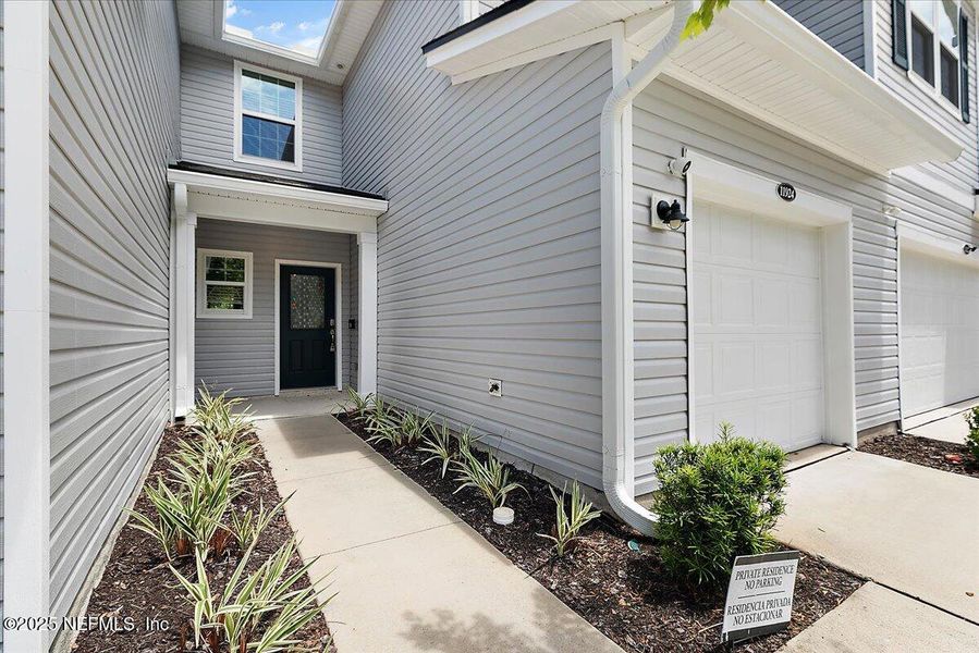 Front exterior of a new home in , Jacksonville, FL, highlighting curb appeal (Image 1).
