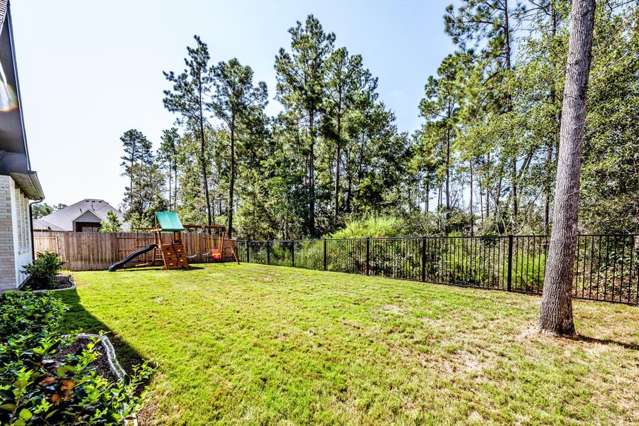 Exterior details and patio area of a home in , Conroe (Image 24).
