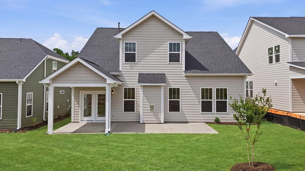 Warm and inviting outdoor living space with a covered rear porch and tasteful finishes located in Simpsonville, SC