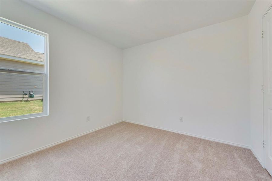 Unfurnished room with carpet