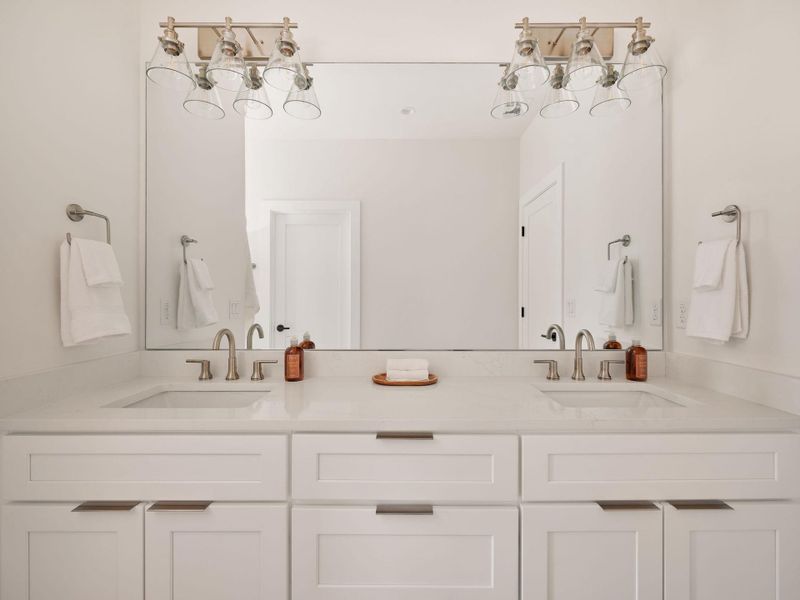 Full bathroom featuring a chandelier and double vanity Full bathroom featuring a chandelier and double vanity