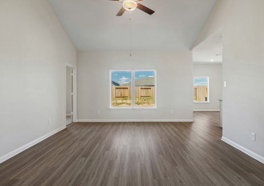 Family room with a window overlooking the backyard Family room with a window overlooking the backyard