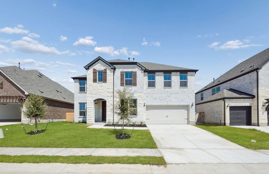 Front exterior of a new home in Bluffview Reserve, Leander, TX, highlighting curb appeal (Image 27).