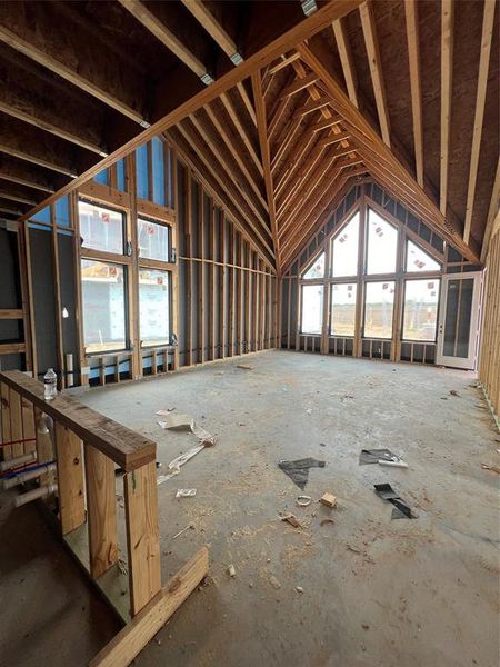 This family room reaches bold new heights with vaulted cathedral style ceilings.