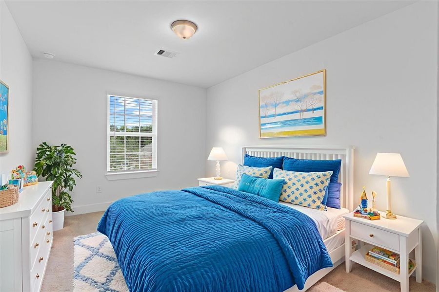 One of the secondary bedrooms offers soft carpeting, a large window for natural light, and a spacious layout—perfect for family, guests, or a flexible home office. *Virtually Staged* **Image Representative of Plan Only and May Vary as Built**. One of the secondary bedrooms offers soft carpeting, a large window for natural light, and a spacious layout—perfect for family, guests, or a flexible home office. *Virtually Staged* **Image Representative of Plan Only and May Vary as Built**.