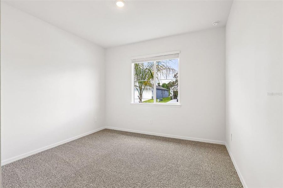 Spacious, unfurnished interior of a new home in The Grove at Stuart Crossing - Signature Series, Bartow (Image 41).