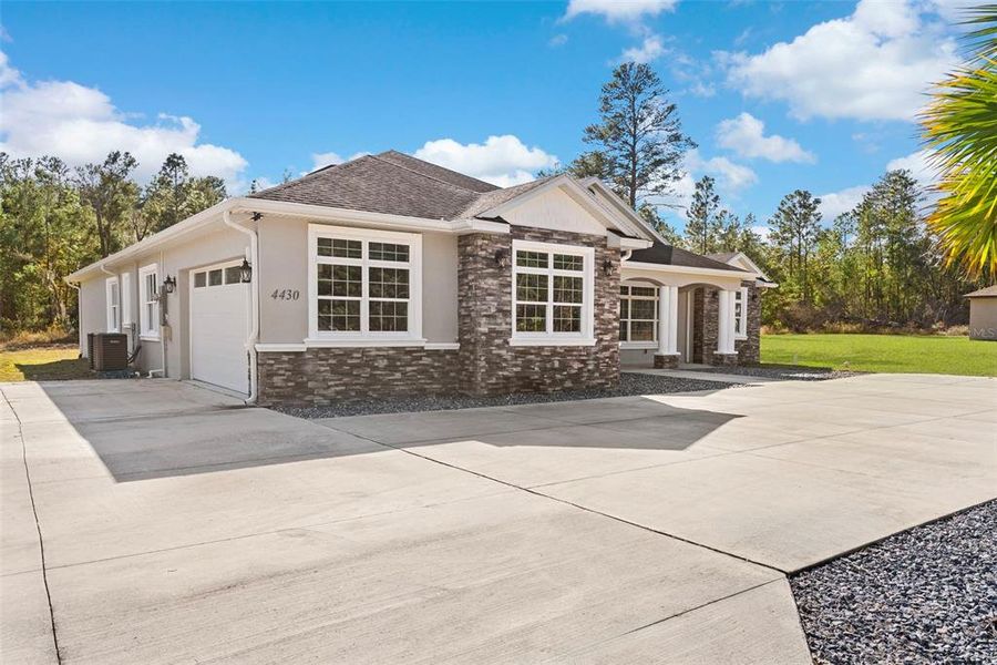 Front exterior of a new home in , Ocala, FL, highlighting curb appeal (Image 21).