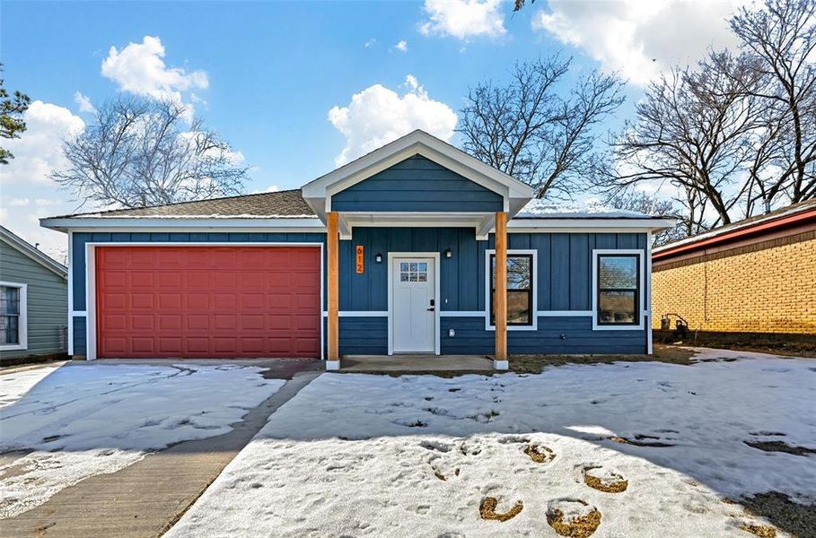 View of front of property with a garage