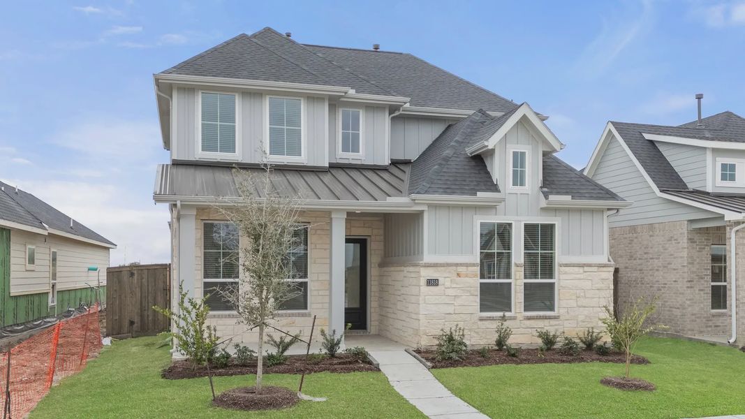 Representative exterior photo of a completed home built from the St Andrews by Chesmar Homes in Riceland Alley Loads, Mont Belvieu, TX (Image 32).
