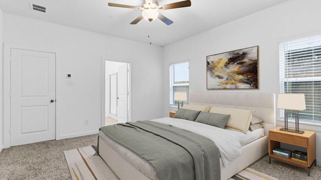 A spacious primary bedroom emphasizing open space and natural lighting with large windows. A spacious primary bedroom emphasizing open space and natural lighting with large windows.