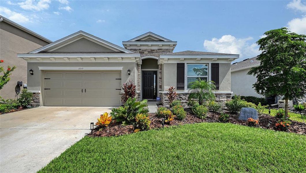 Front exterior of a new home in Solera at Lakewood Ranch, Bradenton, FL, highlighting curb appeal (Image 20).