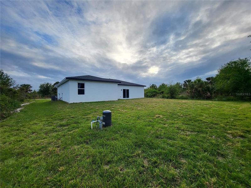 Front exterior of a new home in , Port Charlotte, FL, highlighting curb appeal (Image 21). Front exterior of a new home in , Port Charlotte, FL, highlighting curb appeal (Image 21).