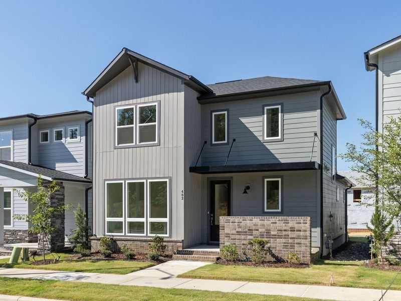 Front exterior of a new home in NoVi Chatham Park - The Garden Collection, Pittsboro, NC, highlighting curb appeal (Image 19).