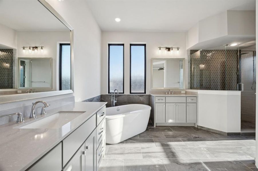 Natural light pouring through windows in primary bathroom.