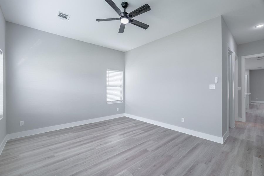 Primary bedroom's ensuite design adds convenience and privacy