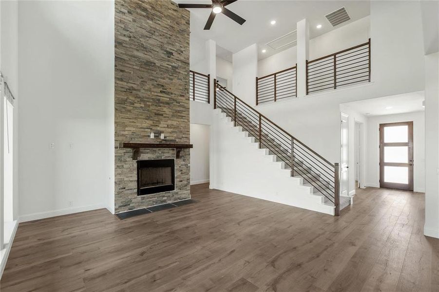 Dramatic Stone Fireplace leads to the second level creating a very Grand and Spacious Living Room.