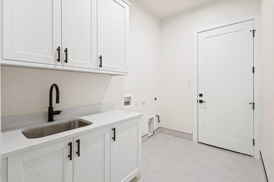 laundry with sink and cabinetry, also as mudroom laundry with sink and cabinetry, also as mudroom