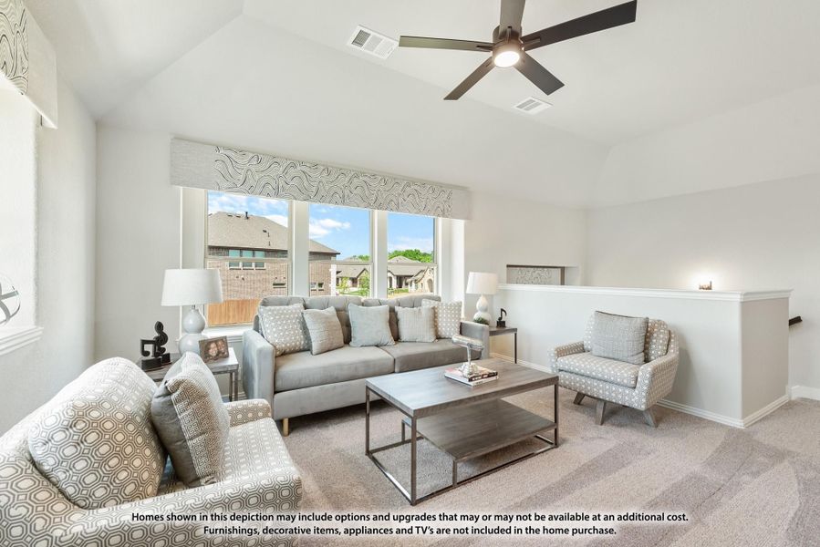 Living room with vaulted ceiling, ceiling fan, gray sofa, accent chairs, and large windows with neighborhood view Living room with vaulted ceiling, ceiling fan, gray sofa, accent chairs, and large windows with neighborhood view