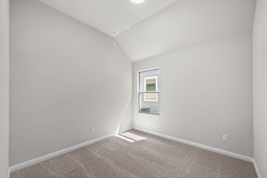 Bedroom in the Spruce home plan by Trophy Signature Homes - REPRESENTATIVE PHOTO Bedroom in the Spruce home plan by Trophy Signature Homes - REPRESENTATIVE PHOTO