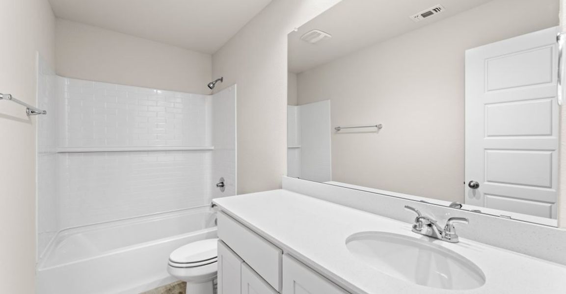 Representative exterior photo of a completed home built from the Austin by Impression Homes in Keeneland, Aubrey, TX (Image 21).