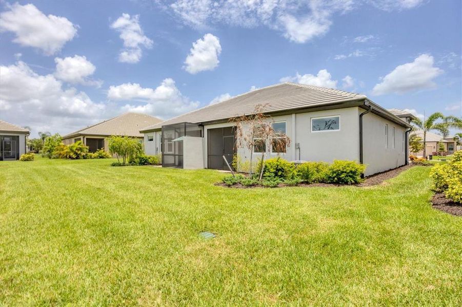 Front exterior of a new home in Sweetwater at Lakewood Ranch, Bradenton, FL, highlighting curb appeal (Image 23).