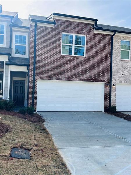 Front exterior of a new home in Kendall Grove, McDonough, GA, highlighting curb appeal (Image 1).