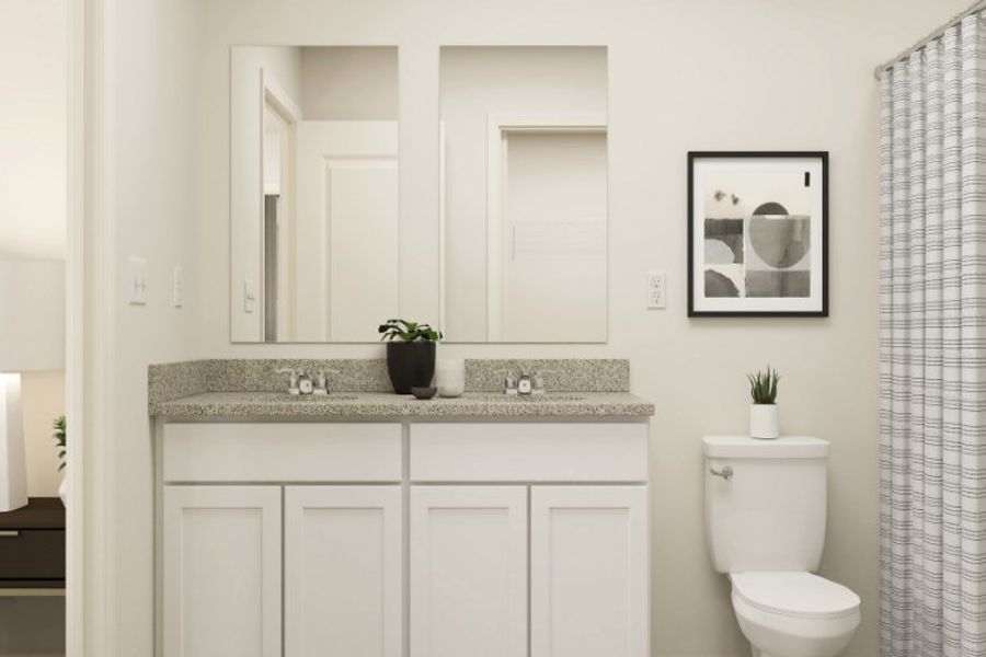 A bathroom with a sink and a toilet.