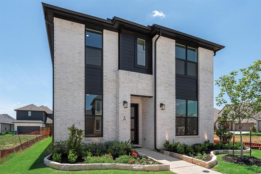 Modern home with brick siding Modern home with brick siding