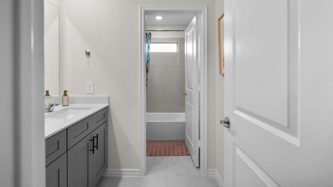 Representative furnished interior of a home built from the HOLLY by D.R. Horton in The Preserve at Forum, Grand Prairie (Image 27).