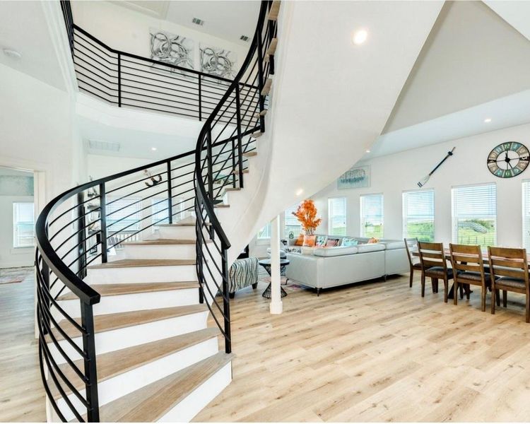 Head up the spiral staircase to the 4 additional bedrooms