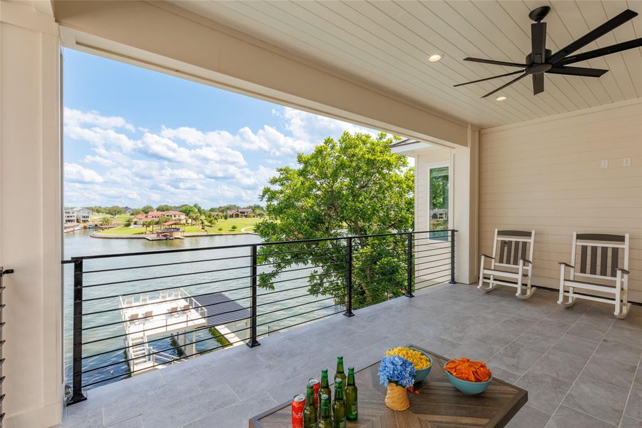 Upper Balcony featuring a water view and ceiling fan. Upper Balcony featuring a water view and ceiling fan.