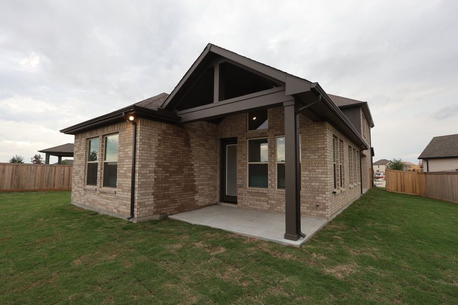 Exterior details and patio area of a home in Prairieland Village - Grove Collection, Cypress (Image 3).